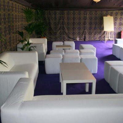 White leather furniture set up for an Ibiza themed party in a tent with Brunel wall linings