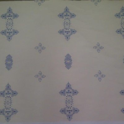 A blue design repeats on an ivory background for a marquee wall lining