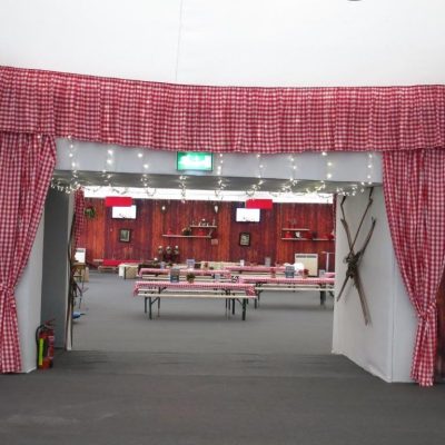 Gingham fabric wall linings draping the padning room entrance