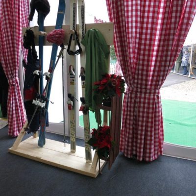 Ski storage prop with gingham curtain dressing