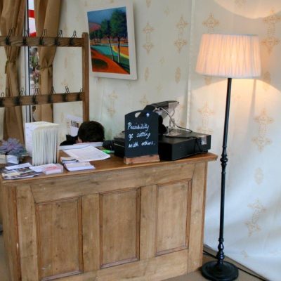 A wooden Reception desk at Cheltenham Literature festival