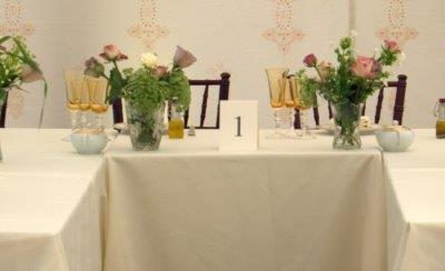 A wedding breakfast set up styled with amber yellow glassware