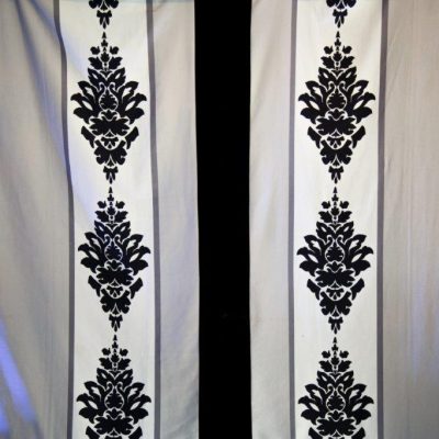 Rococo marquee wall linings with a black print pattern on black white and grey stripes