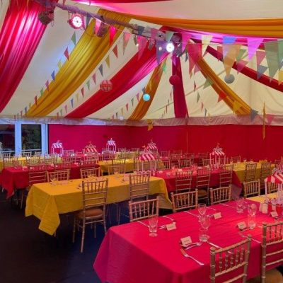Scarlet marquee wall linings with circus themed ceiling linings in red and yellow