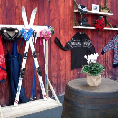 Skis and other props stand in a marquee which has been dressed with wood plank effect wall linings