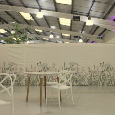 Room divider dressed with botanical wall linings for Malvern three counties showground spring fair